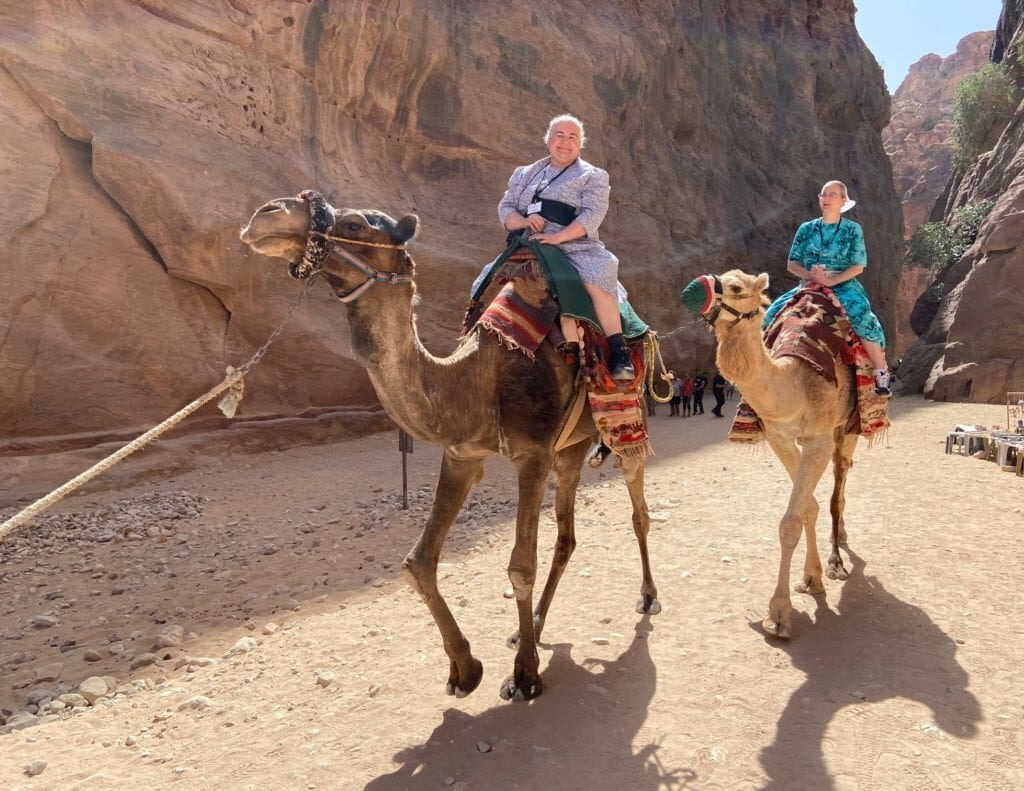 Riding camels at Petra